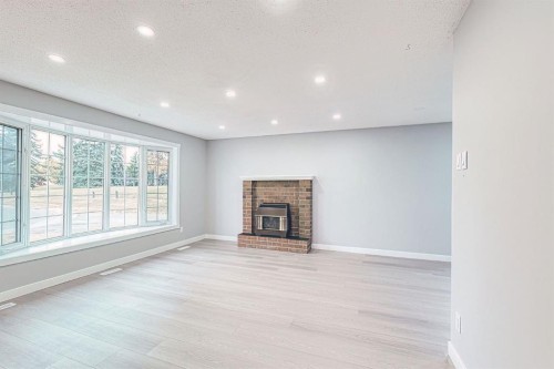 24 Rundleson Way Ne, Calgary, AB - Indoor With Fireplace