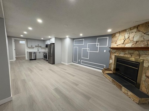 24 Rundleson Way Ne, Calgary, AB - Indoor With Fireplace