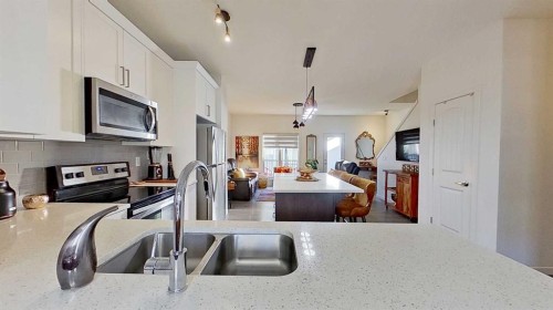 132 Legacy Point Se, Calgary, AB - Indoor Photo Showing Kitchen With Stainless Steel Kitchen With Double Sink With Upgraded Kitchen