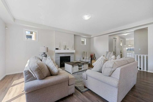 2091 Windbury Crescent Sw, Airdrie, AB - Indoor Photo Showing Living Room With Fireplace
