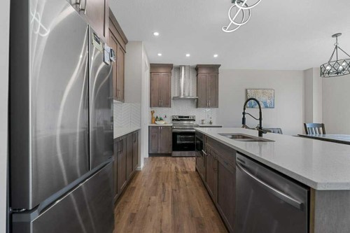 2091 Windbury Crescent Sw, Airdrie, AB - Indoor Photo Showing Kitchen With Double Sink With Upgraded Kitchen