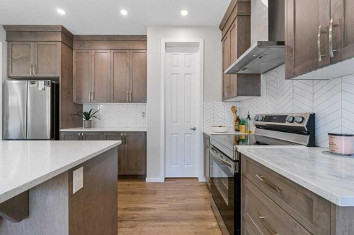 2091 Windbury Crescent Sw, Airdrie, AB - Indoor Photo Showing Kitchen With Upgraded Kitchen