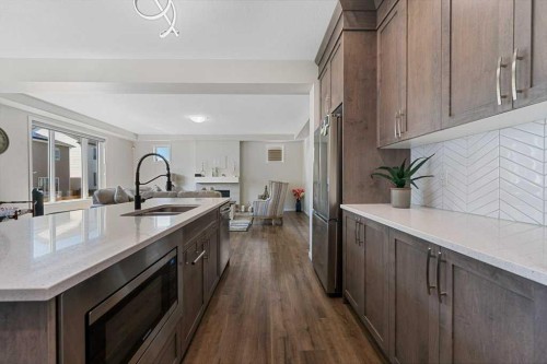 2091 Windbury Crescent Sw, Airdrie, AB - Indoor Photo Showing Kitchen With Double Sink With Upgraded Kitchen