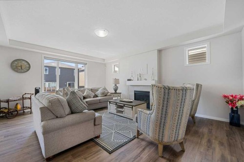2091 Windbury Crescent Sw, Airdrie, AB - Indoor Photo Showing Living Room With Fireplace