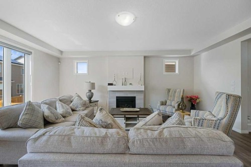 2091 Windbury Crescent Sw, Airdrie, AB - Indoor Photo Showing Living Room With Fireplace