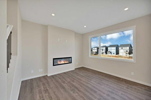 537 Chelsea Gardens, Chestermere, AB - Indoor Photo Showing Living Room With Fireplace