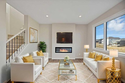 537 Chelsea Gardens, Chestermere, AB - Indoor Photo Showing Living Room With Fireplace