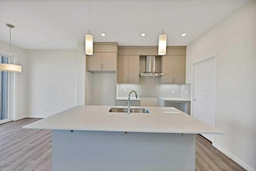 537 Chelsea Gardens, Chestermere, AB - Indoor Photo Showing Kitchen With Double Sink With Upgraded Kitchen