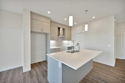 537 Chelsea Gardens, Chestermere, AB - Indoor Photo Showing Kitchen With Double Sink