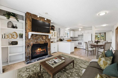 1613 43 Street Sw, Calgary, AB - Indoor Photo Showing Living Room With Fireplace