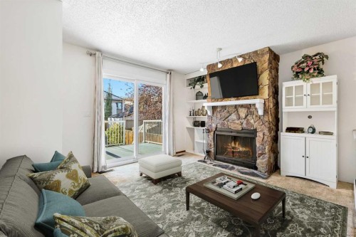 1613 43 Street Sw, Calgary, AB - Indoor Photo Showing Living Room With Fireplace