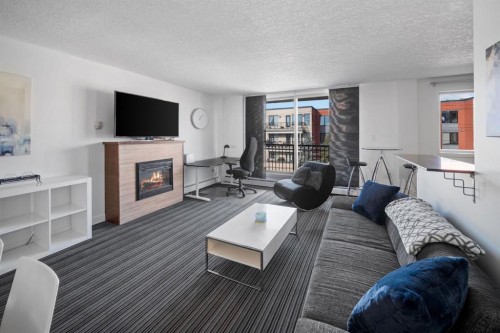 406-1420 Memorial Drive Nw, Calgary, AB - Indoor Photo Showing Living Room With Fireplace