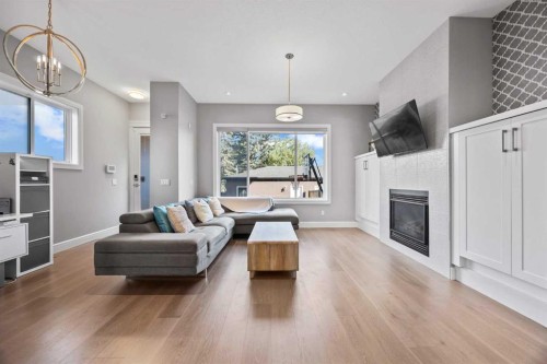 1906 22 Avenue Nw, Calgary, AB - Indoor Photo Showing Living Room With Fireplace