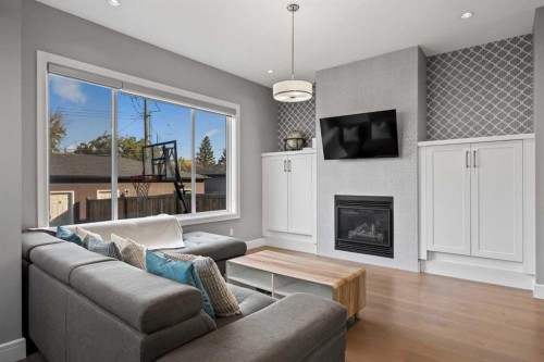 1906 22 Avenue Nw, Calgary, AB - Indoor Photo Showing Living Room With Fireplace