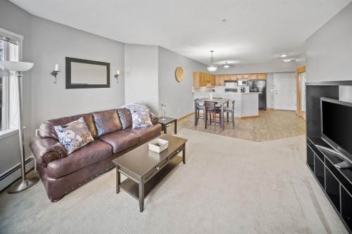 207-200 Lincoln Way Sw, Calgary, AB - Indoor Photo Showing Living Room
