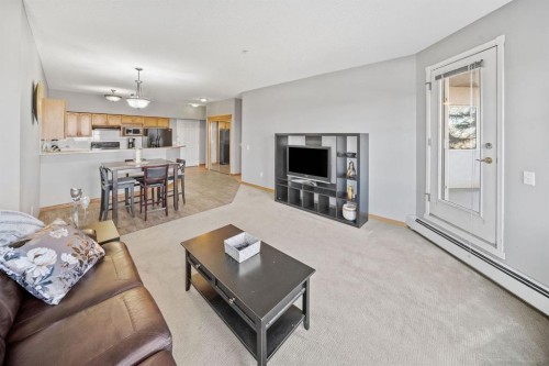 207-200 Lincoln Way Sw, Calgary, AB - Indoor Photo Showing Living Room