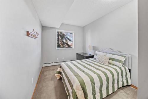 207-200 Lincoln Way Sw, Calgary, AB - Indoor Photo Showing Bedroom