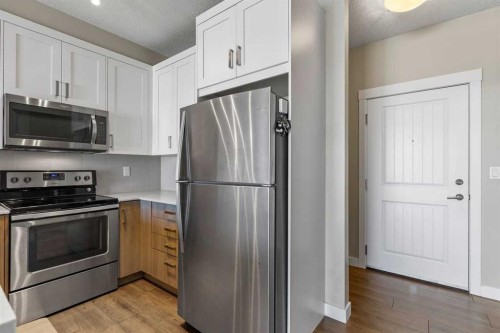 417-110 Auburn Meadows View Se, Calgary, AB - Indoor Photo Showing Kitchen With Stainless Steel Kitchen