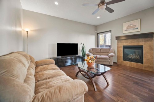 508 Everbrook Way Sw, Calgary, AB - Indoor Photo Showing Living Room With Fireplace