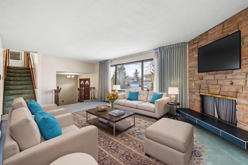 3375 Breton Close Nw, Calgary, AB - Indoor Photo Showing Living Room With Fireplace