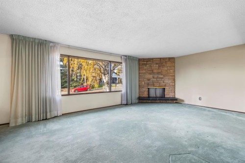 3375 Breton Close Nw, Calgary, AB - Indoor Photo Showing Living Room With Fireplace