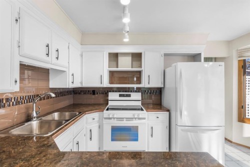 3375 Breton Close Nw, Calgary, AB - Indoor Photo Showing Kitchen With Double Sink