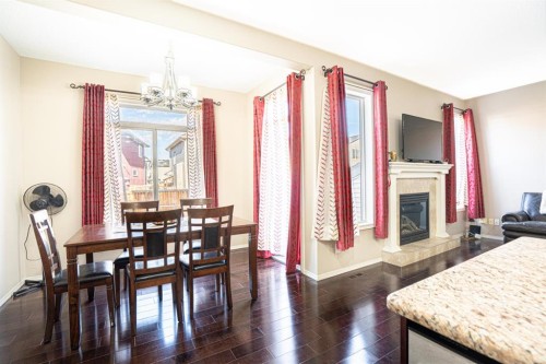 269 Skyview Shores Manor Ne, Calgary, AB - Indoor Photo Showing Dining Room With Fireplace