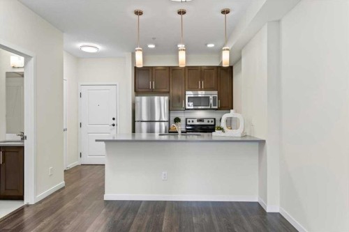 218-10 Mahogany Mews Se, Calgary, AB - Indoor Photo Showing Kitchen With Stainless Steel Kitchen With Upgraded Kitchen