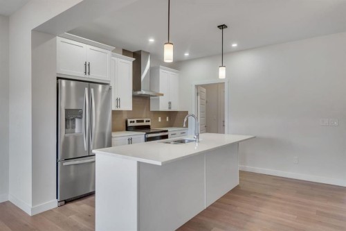 1489 Bayview Point Sw, Airdrie, AB - Indoor Photo Showing Kitchen With Stainless Steel Kitchen With Upgraded Kitchen