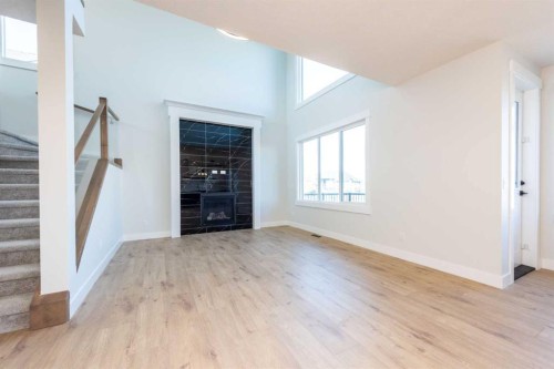 22 Cimarron Estates Gate, Okotoks, AB - Indoor With Fireplace