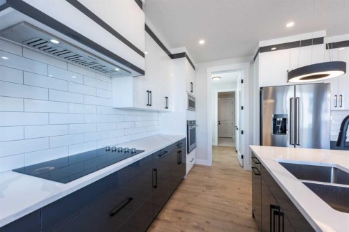 22 Cimarron Estates Gate, Okotoks, AB - Indoor Photo Showing Kitchen With Double Sink With Upgraded Kitchen