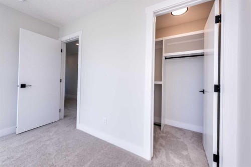 22 Cimarron Estates Gate, Okotoks, AB - Indoor Photo Showing Other Room