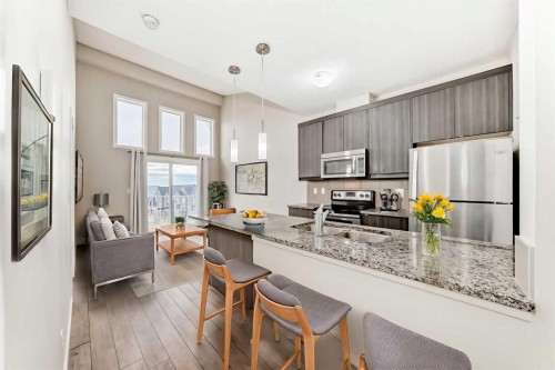 415-402 Marquis Lane Se, Calgary, AB - Indoor Photo Showing Kitchen With Stainless Steel Kitchen With Upgraded Kitchen