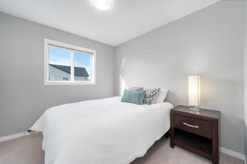 64 Copperpond Park Se, Calgary, AB - Indoor Photo Showing Bedroom