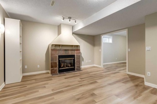 1880 Thornbird Road Se, Airdrie, AB - Indoor With Fireplace