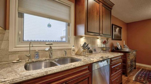 232 Penbrooke Way Se, Calgary, AB - Indoor Photo Showing Kitchen With Double Sink