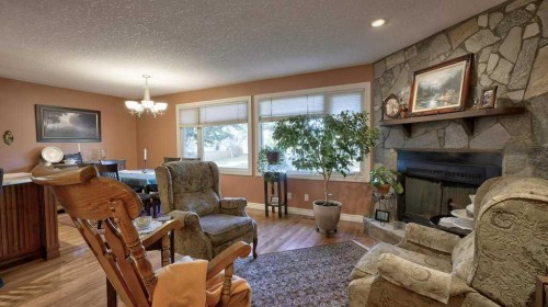 232 Penbrooke Way Se, Calgary, AB - Indoor Photo Showing Living Room With Fireplace