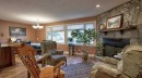 232 Penbrooke Way Se, Calgary, AB  - Indoor Photo Showing Living Room With Fireplace 