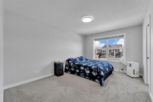 67 Corner Glen Gardens Ne, Calgary, AB - Indoor Photo Showing Bedroom
