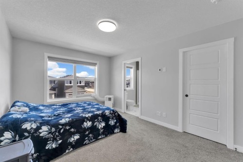 67 Corner Glen Gardens Ne, Calgary, AB - Indoor Photo Showing Bedroom