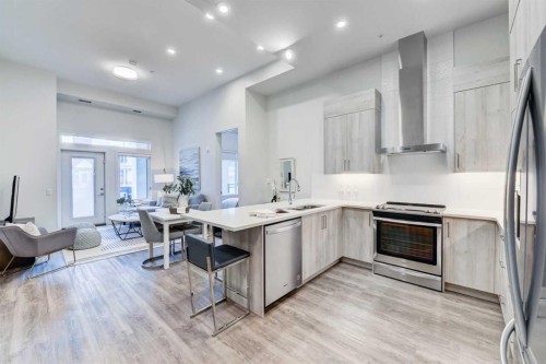 112-24 Mahogany Path Se, Calgary, AB - Indoor Photo Showing Kitchen With Double Sink With Upgraded Kitchen