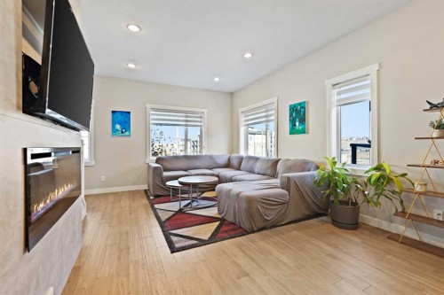 357 Sage Hill Circle Nw, Calgary, AB - Indoor Photo Showing Living Room With Fireplace