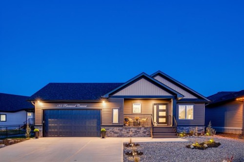 185 Riverwood Crescent, Diamond Valley, AB - Outdoor With Facade