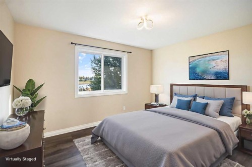 100 Lakeside View, Strathmore, AB - Indoor Photo Showing Bedroom