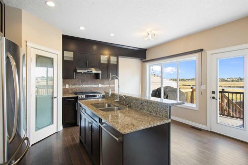 100 Lakeside View, Strathmore, AB - Indoor Photo Showing Kitchen With Double Sink With Upgraded Kitchen