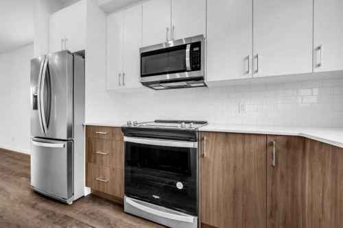 101-25 Evanscrest Mews Nw, Calgary, AB - Indoor Photo Showing Kitchen With Stainless Steel Kitchen With Upgraded Kitchen