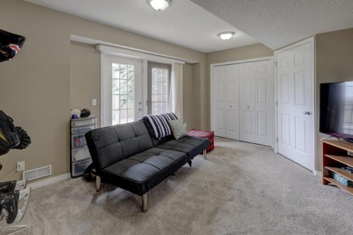 82 Country Hills Cove Nw, Calgary, AB - Indoor Photo Showing Living Room