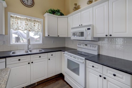 82 Country Hills Cove Nw, Calgary, AB - Indoor Photo Showing Kitchen With Double Sink