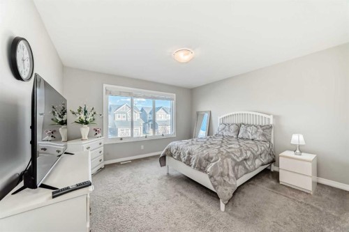 615 Kingsmere Way Se, Airdrie, AB - Indoor Photo Showing Bedroom