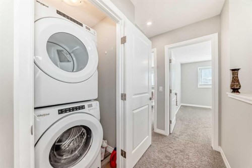 615 Kingsmere Way Se, Airdrie, AB - Indoor Photo Showing Laundry Room
